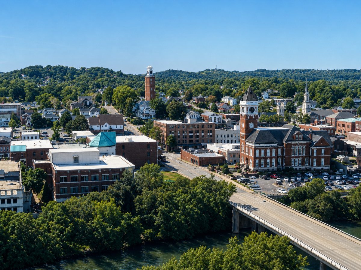 Aerial view of downtown Rome, Georgia — the Clocktower above the historic district, with the river and bridge in the foreground.